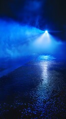 Wall Mural - atmospheric blue light beam illuminating foggy surface with water reflection at night creating a mys