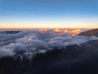 Amazing Sunrise or sunset over mountains hills covered with mist, Aerial view landscape drone shot beautiful colorful nature background