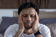 © anut21ng Stock - portrait of asian man suffers from tension headaches