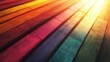 © peppastocker - Abstract background with colorful wooden planks arranged in a rainbow pattern with a warm sun flare.