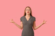 © Pixel-Shot - Beautiful young businesswoman meditating on pink background. Zen concept