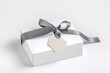 © thoriq - Elegant White Gift Box with Grey Ribbon
