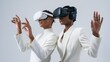 © theoarista - Two people exploring virtual reality with VR headsets.