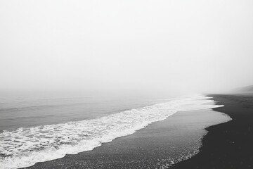 Poster - Gentle waves lapping on a minimalist ocean shore tranquil beach scene nature photography serene landscape wide-angle view peaceful concept for relaxation and mindfulness
