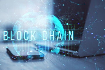 Poster - Blockchain technology hologram over smartphone and laptop on table, with glowing world map concept in background.