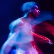 © Siriroj - Captivating Modern Dance Performance with Vibrant Motion Blur and Stage Lighting
