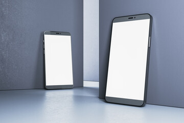 Poster - Two modern smartphones with blank screens leaning against a wall. Digital device mockup concept. Minimalistic design. 3D Rendering