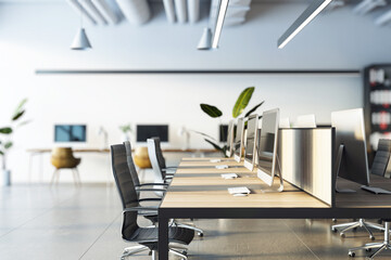 Poster - Modern open office layout with wooden desks, ergonomic chairs, computers, and plants in a bright and spacious work environment. 3D Rendering