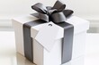© thoriq - Elegant White Gift Box with Grey Ribbon