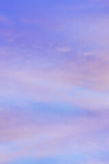 Wall Mural - Sky with soft and fluffy pastel orange pink and blue colored clouds. Sunset background. Nature. sunrise. Vertical
