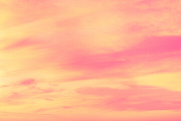 Wall Mural - Sky with soft and fluffy pastel coral orange pink and blue colored clouds. Sunset background. Nature. sunrise. Instagram toned style