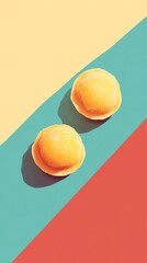 Sunny Side Up: Two golden dumplings bask in the warm glow of a vibrant, retro-styled color block background.  A playful image, perfect for food blogs, restaurants, or packaging. 