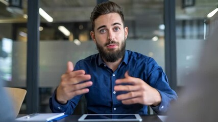 Poster - A man wearing a VR headset engages with a tablet in a modern workspace.
