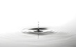 © Teerasak - single water droplet creates ripples on calm surface, capturing moment of tranquility and reflection. concentric circles spread outward, symbolizing peace and harmony