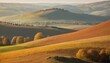 © Interactify - soft-focused autumn landscape with rolling hills