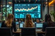 © kriengsak - Businesswomen Analyzing Financial Data on Large Screen in Modern Office