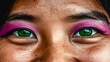 © IMPic - Close-up of a Young Woman's Eyes with Vibrant Purple Eye Makeup and Striking Green Irises