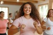 © EvgeniiasArt - Happy women participating in energetic group fitness class with smiles