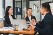 © kenchiro168 - Professional team meeting in modern office, discussing strategies and ideas. atmosphere is collaborative and focused, showcasing teamwork and communication