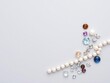 © PuriStudio - Assorted sparkling jewels on a sleek grey background, grey, accessories, precious