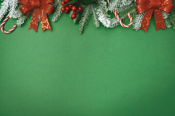 Wall Mural - christmas and happy new year background with gold glitter decorations on green bright background. ho