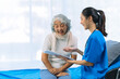 © ArLawKa - A female patient visits the doctor at the nursing department to discuss her illness and find treatment guidelines. Strong medical concept