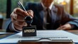 © Bluenana - Businessman Approving a Document with a Stamp