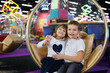 © Studio Peace - Happy and cheerful children, a boy and a girl, in a modern playroom.