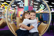© Studio Peace - Happy and cheerful children, a boy and a girl, in a modern playroom.