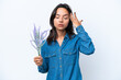 © luismolinero - Young hispanic woman holding lavender isolated on white background with headache