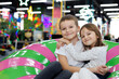 © Studio Peace - Happy and cheerful children, a boy and a girl, in a modern playroom.