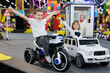 © Studio Peace - Happy children, a boy and a girl, are riding cars and motorcycles in a modern playroom.