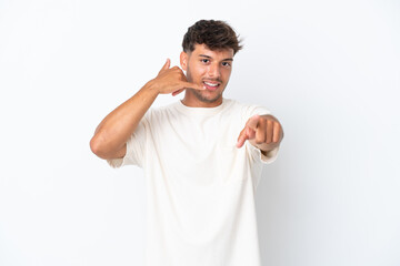 Sticker - Young caucasian handsome man isolated on white background making phone gesture and pointing front