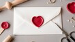 © Olga - A creative love letter with a red heart seal on an elegant envelope surrounded by crafting tools, rings, and decorative elements for a personal touch