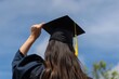 © Masque - Graduating Woman Flings Cap Upward into Clear Blue Sky