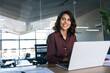 © Stock 4 You - Portrait of smiling latin hispanic middle-aged business woman work on laptop computer in modern office. Indian young businesswoman professional employee using pc, looking dreaming aside. Copy space
