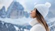 © ChimE - A cheerful woman enjoys the winter wonderland, surrounded by majestic mountains and serene forests.
