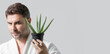 © Volodymyr - Aloe vera for cosmetics skin mask. Facial mask with aloe vera. Spa, dermatology, wellness and facial treatment concept. Male cosmetic mask with aloe vera. Web banner header, copy space.