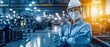 © Seksan - A factory worker in protective gear stands confidently in an industrial setting, highlighting safety and professionalism in a manufacturing environment.
