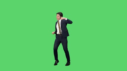 Fototapete - 嬉しくてダンスする男性ビジネスパーソンの全身動画　クロマキー合成用グリーンバック映像