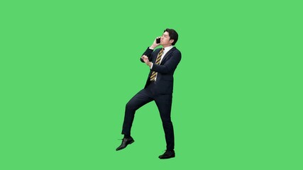 Leinwandbilder - スマホで通話しながらダンスする男性ビジネスパーソンの全身動画　クロマキー合成用グリーンバック映像