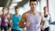 © pattozher - Focused Determination: A man runs on a treadmill, eyes fixed on the horizon, showcasing dedication and unwavering focus, his muscular physique a testament to his rigorous workout routine.