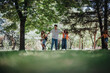 © qunica.com - Young teenagers having fun in the park showcasing friendship, joy, and moments of laughter and happiness among nature.