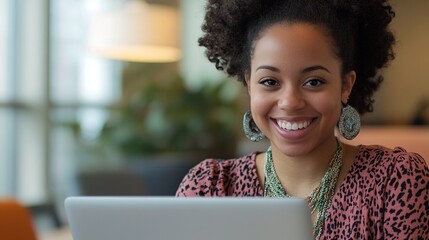 Wall Mural - Young Woman Smiling While Working in a Corporate Office Environment, Focused on Her Laptop and Engaging in Professional Activities