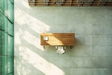 Aufkleber - Overhead view of a wooden desk with a chair and book in a library.
