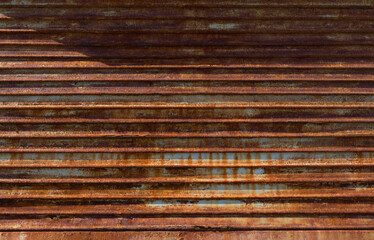 Wall Mural - old weathered and rusted steel door background texture.