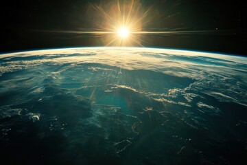 Wall Mural - sunrise over earth from space, with a sunburst.