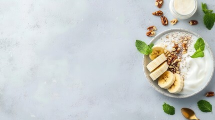 Wall Mural - Sliced bananas on a healthy diet plate, with yogurt and nuts, nutritious meal