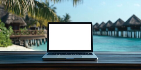 Poster - Laptop with blank screen on a wooden table with tropical beach and blue water in the background.