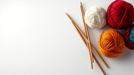 Poster - white background with a few balls of yarn and two knitting needles. the yarn is in various colors an